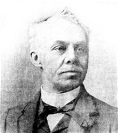 A black and white portrait of Charles Rouss.