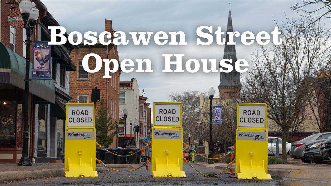 a view down Boscawen Street with three yellow barriers that state 